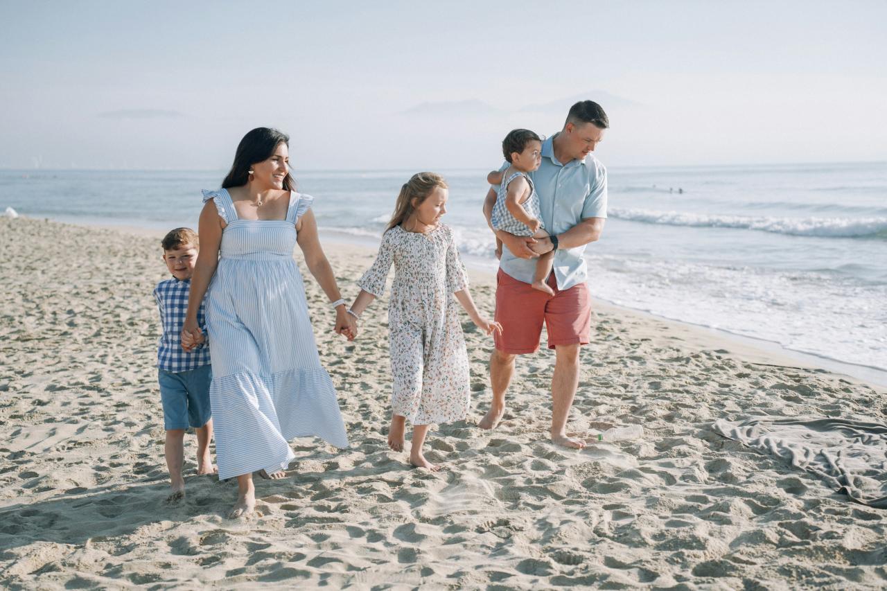 a family walking on the beach